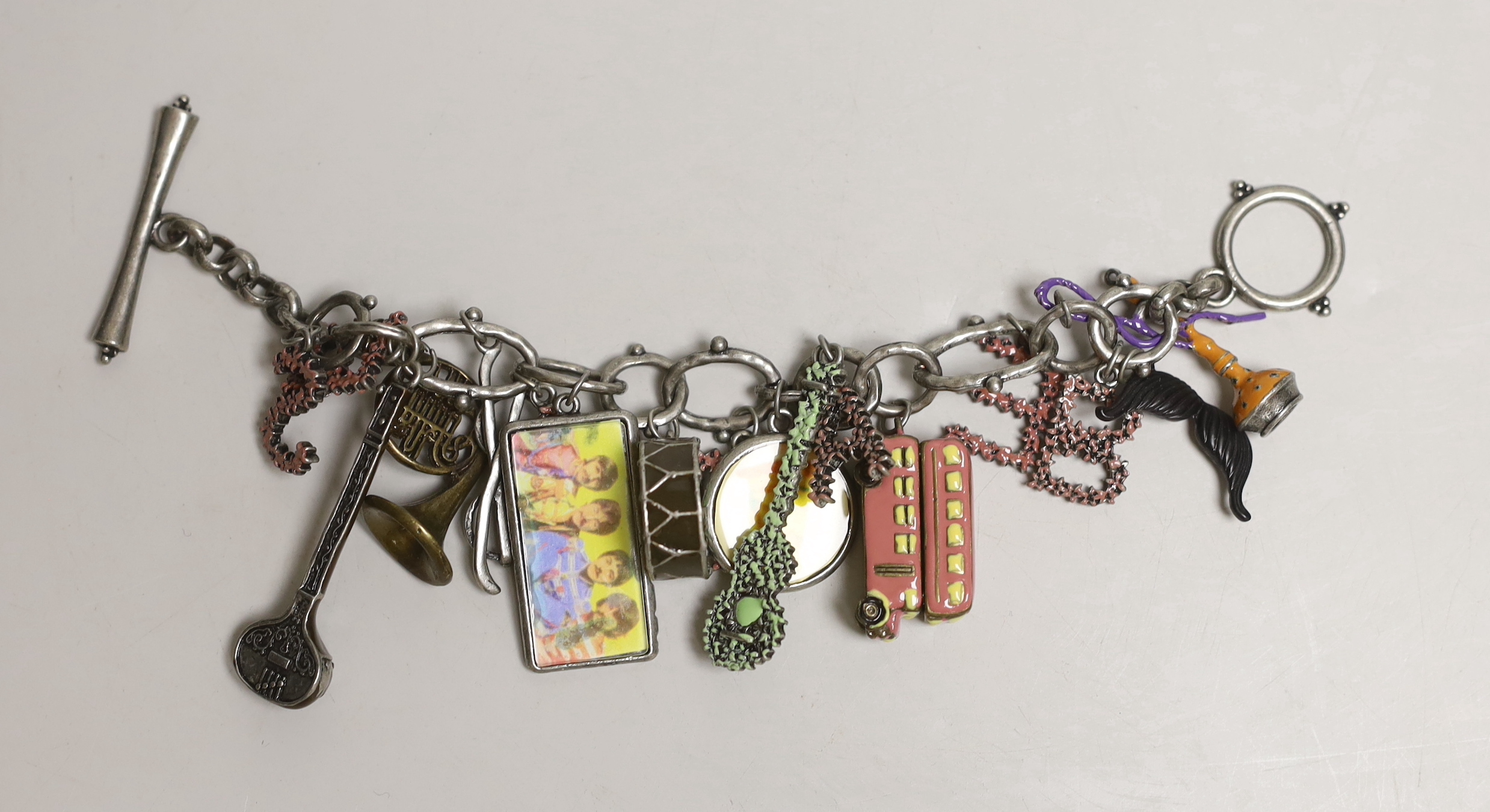 A metal Beatles memorabilia charm bracelet